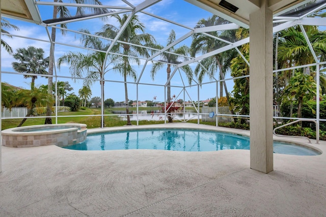 view of pool featuring an in ground hot tub, a lanai, a water view, and a patio area