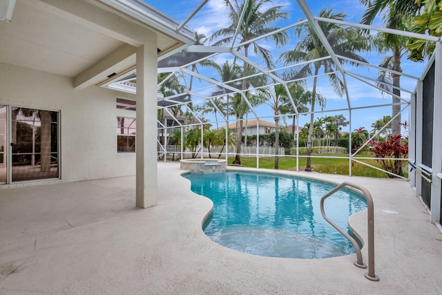 view of swimming pool with a patio, glass enclosure, and an in ground hot tub