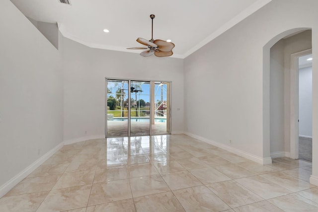 unfurnished room with ceiling fan and crown molding