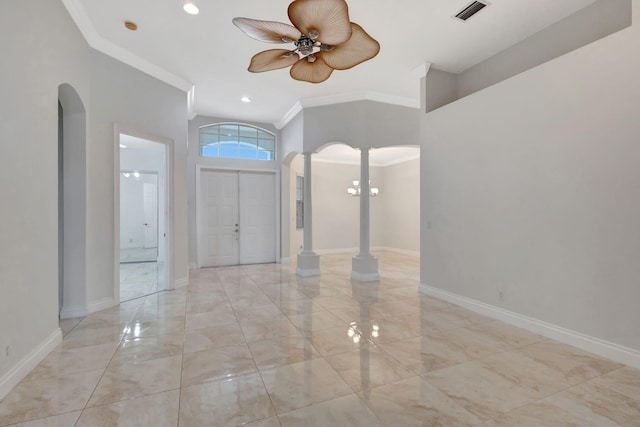 entryway with ceiling fan, crown molding, and decorative columns