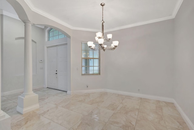 foyer featuring crown molding and decorative columns