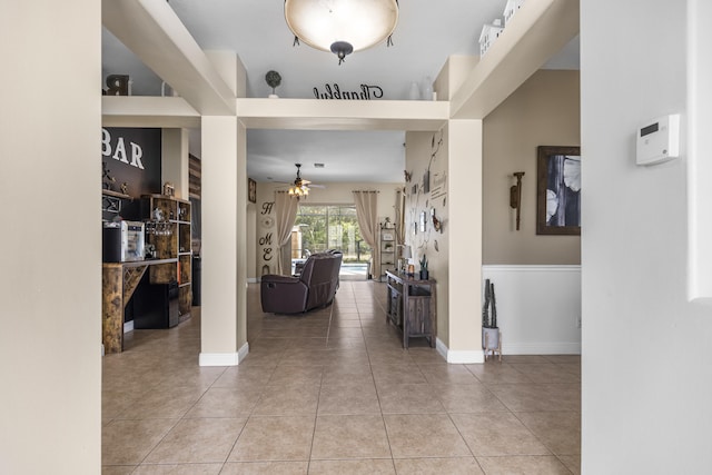 corridor featuring light tile patterned floors