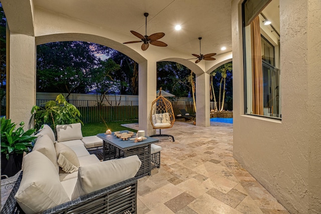 view of patio featuring ceiling fan and an outdoor hangout area