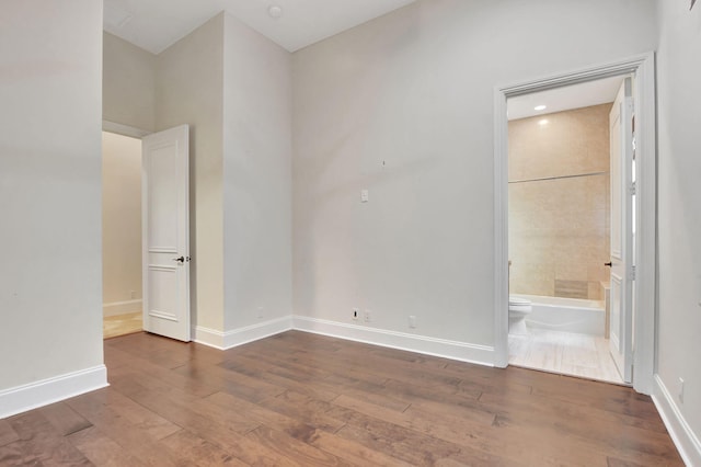 empty room featuring hardwood / wood-style flooring