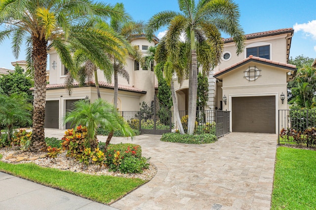 mediterranean / spanish-style home featuring a garage