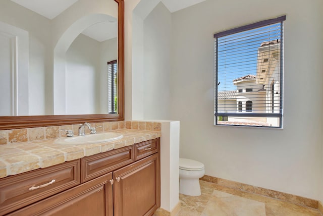 bathroom featuring toilet and vanity