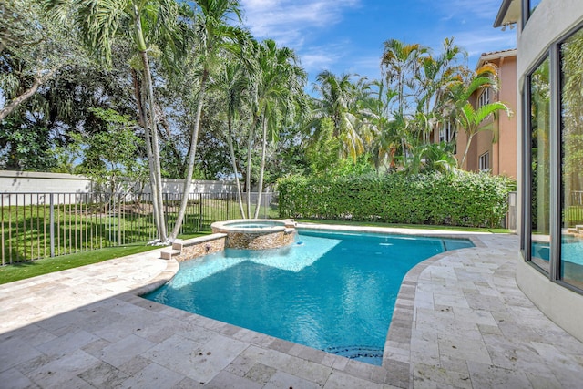 view of swimming pool featuring an in ground hot tub and a patio