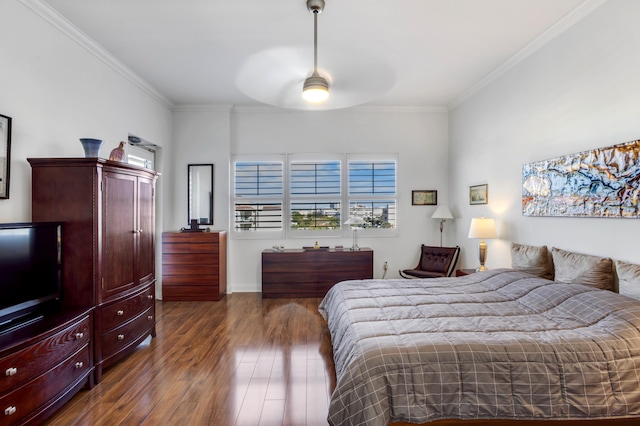 bedroom featuring crown molding and dark hardwood / wood-style floors