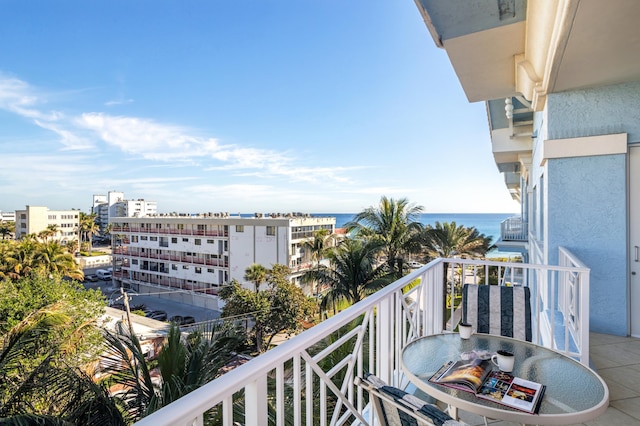 balcony featuring a water view