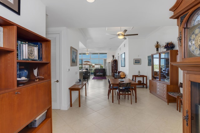 dining area featuring ornamental molding and ceiling fan