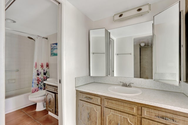 full bathroom with toilet, vanity, tile patterned flooring, and shower / bath combo with shower curtain