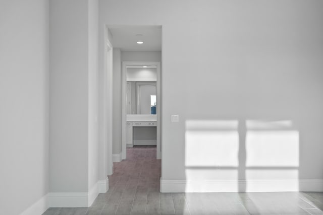 hallway with wood-type flooring