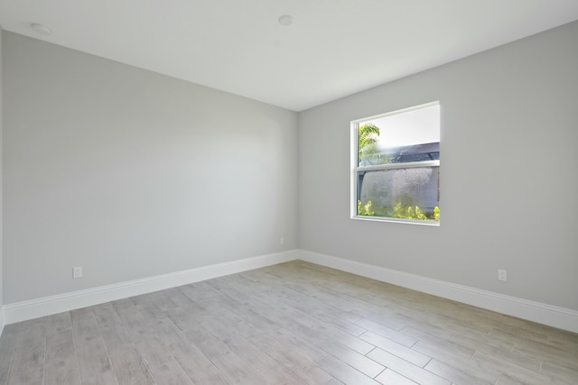 empty room with light hardwood / wood-style floors