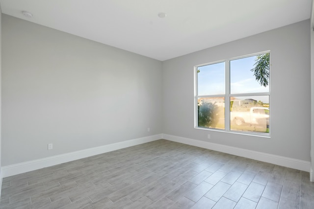 unfurnished room with light hardwood / wood-style flooring