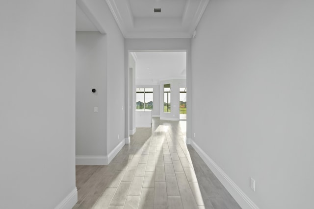 corridor featuring crown molding