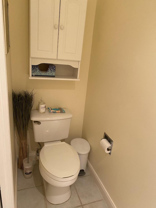 bathroom featuring toilet and tile patterned flooring