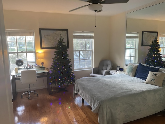 bedroom featuring hardwood / wood-style flooring and ceiling fan