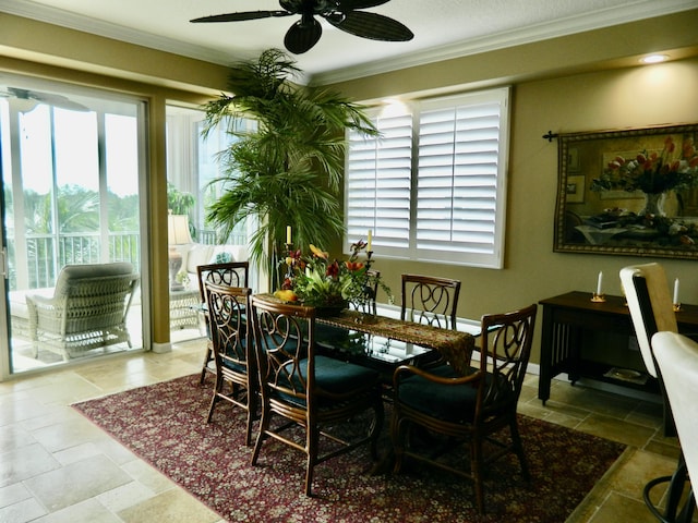 dining room featuring ceiling fan, ornamental molding, and plenty of natural light