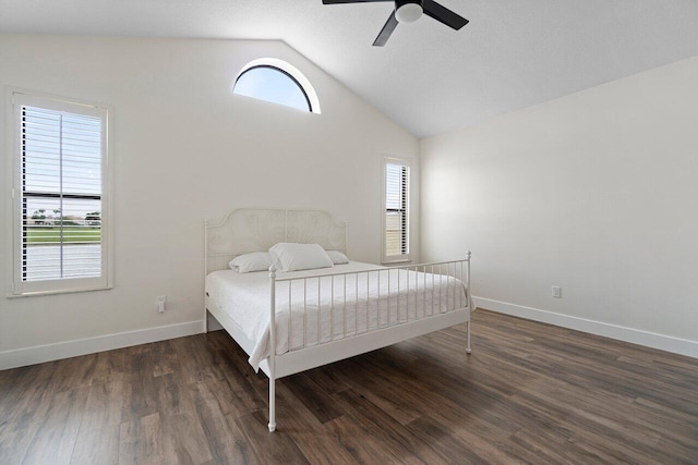 bedroom featuring ceiling fan, dark hardwood / wood-style flooring, and lofted ceiling