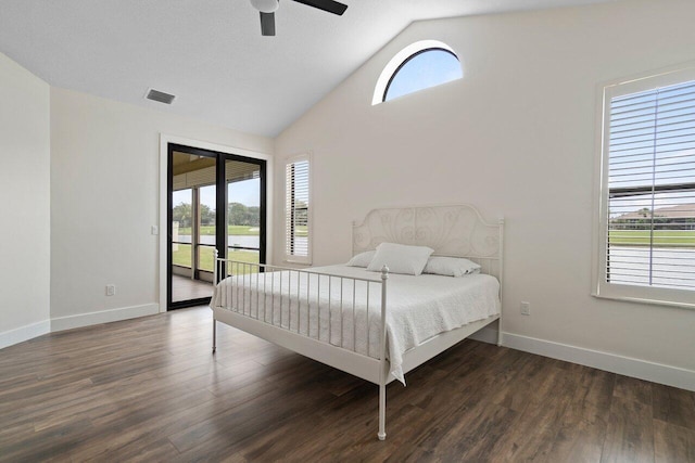 bedroom with ceiling fan, access to exterior, multiple windows, and dark wood-type flooring