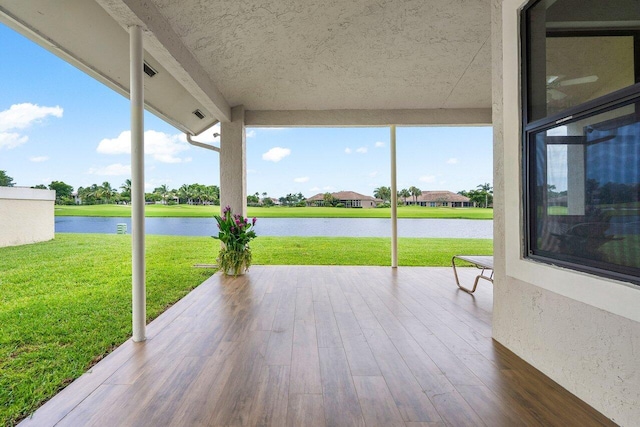 view of patio featuring a water view