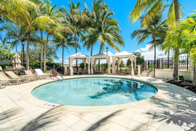 view of pool with a patio area and a gazebo