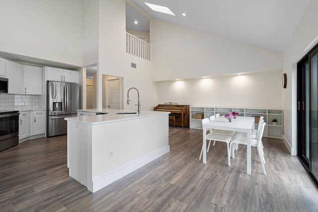 kitchen featuring white cabinetry, sink, stainless steel appliances, and dark hardwood / wood-style floors