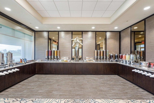 bathroom with a raised ceiling and vanity