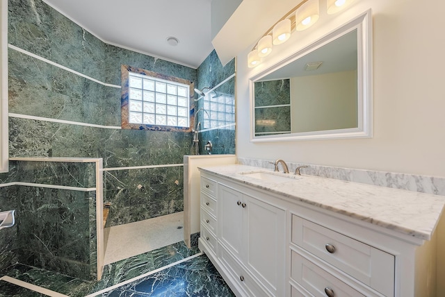 bathroom featuring vanity and a tile shower