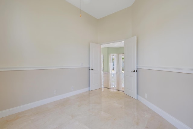 spare room with a high ceiling