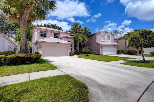 view of front of home featuring a garage and a front yard