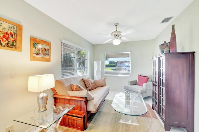 living room featuring ceiling fan and wood-type flooring