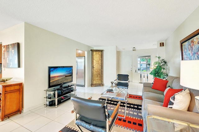 living room with light tile patterned floors and a textured ceiling