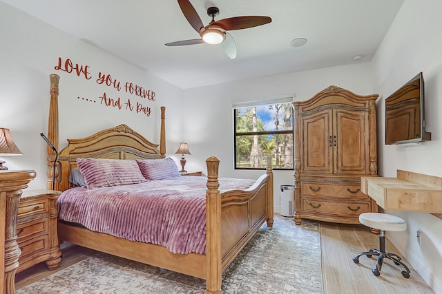 bedroom with hardwood / wood-style flooring and ceiling fan