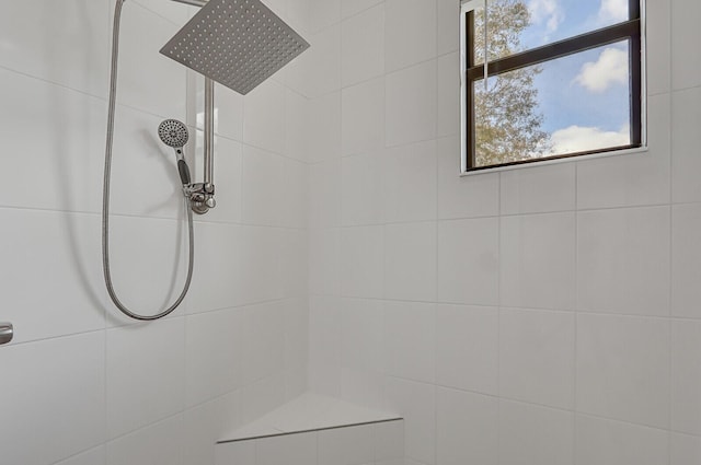 bathroom with a tile shower