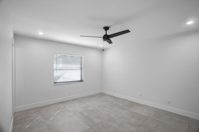 tiled empty room with ceiling fan