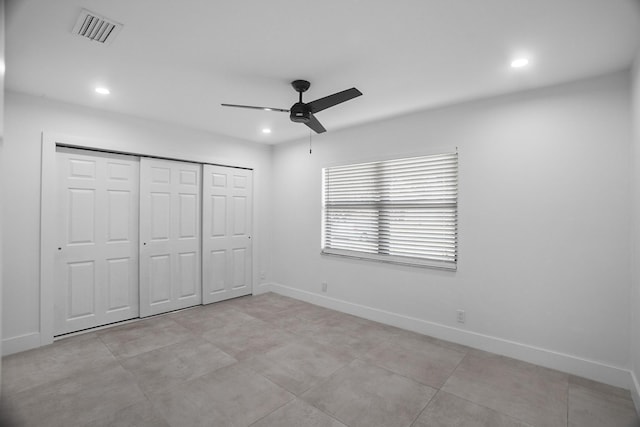 unfurnished bedroom featuring a closet and ceiling fan