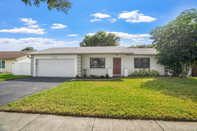 ranch-style home featuring a garage, a front lawn, and a porch