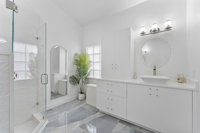 bathroom with walk in shower and vanity