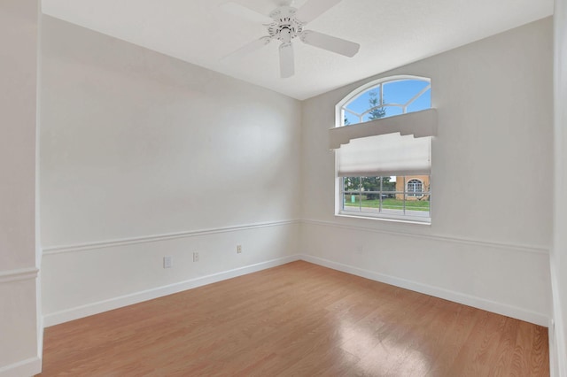 spare room featuring hardwood / wood-style floors and ceiling fan