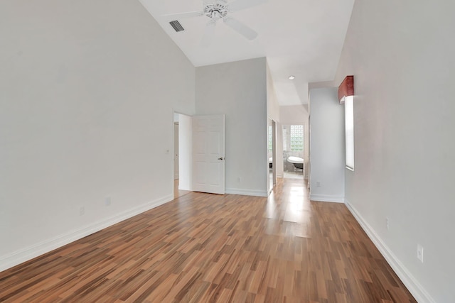 unfurnished living room with wood-type flooring and ceiling fan