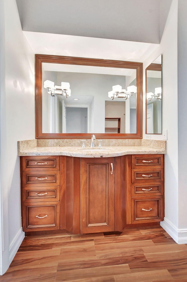 bathroom featuring hardwood / wood-style flooring and vanity