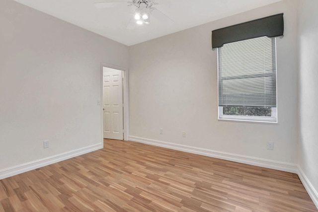 empty room featuring ceiling fan and light wood-type flooring