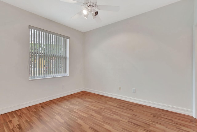 spare room with light hardwood / wood-style flooring and ceiling fan