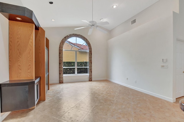 unfurnished living room featuring ceiling fan and high vaulted ceiling