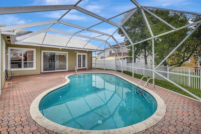 view of pool with a lanai and a patio