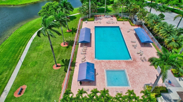 birds eye view of property with a water view