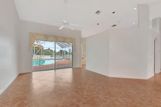 empty room featuring light tile patterned flooring and ceiling fan