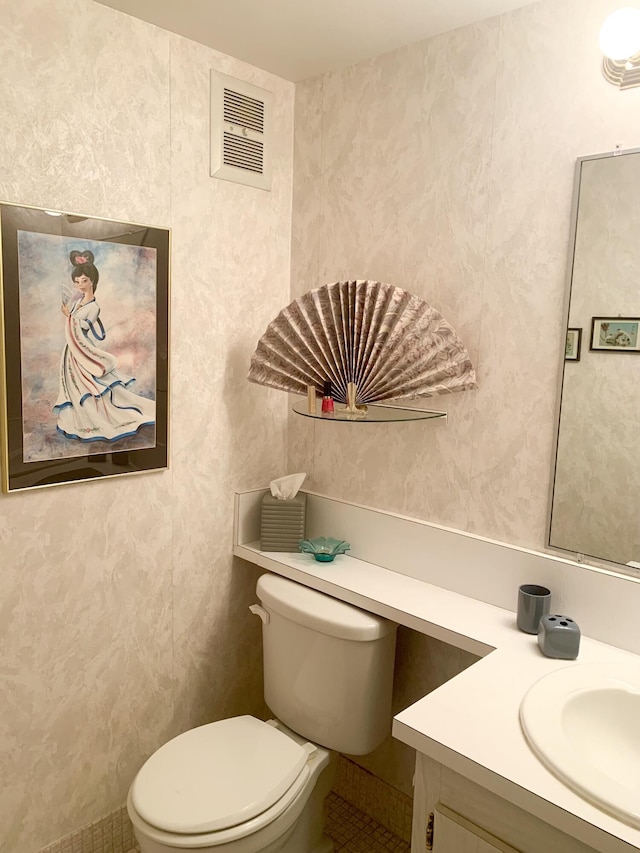 bathroom with tile patterned floors, toilet, and vanity