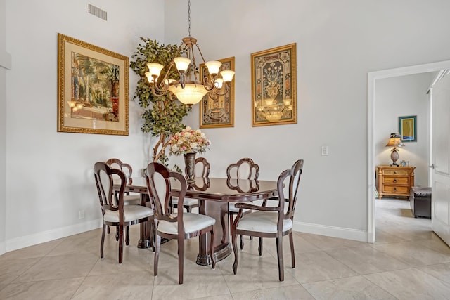 tiled dining area featuring a notable chandelier